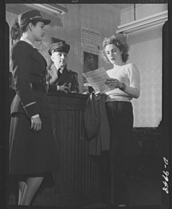 Looking_over_the_job_application_blank_8b06434v